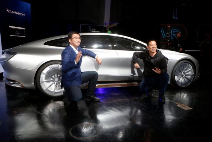 LeEco CEO and founder YT Jia, R, and co-founder and Global Vice Chairman Lei Ding pose in front of a LeSEE car during a press event in San Francisco, California, U.S. October 19, 2016. RETUERS/Beck Diefenbach